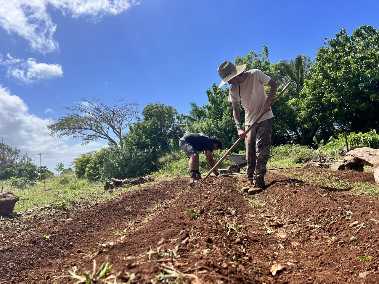 A student working the soil on the Molokaʻi High School farm